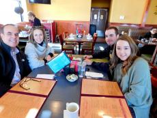 Family enjoying lunch at Pomegranate Restaurant in Aurora