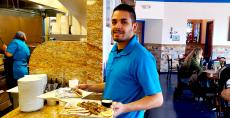 Friendly server at QP Greek Food With a Kick in Hoffman Estates