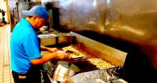 Cooking the famous souvlaki at QP Greek Food With a Kick in Hoffman Estates