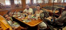 Family enjoying breakfast at Red Apple Pancake House in Carol Stream