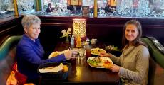 Friends enjoying dinner at Rose Garden Cafe in Elk Grove Village