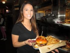 Server with famous burgers at North Branch Pizza and Burger Co. in Glenview