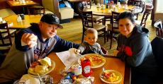 Family enjoying breakfast at Tasty Waffle Restaurant in Romeoville