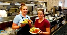 Friendly servers with wraps at Tasty Waffle Restaurant in Romeoville
