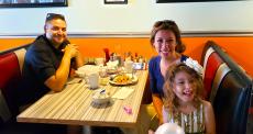 Family enjoying lunch at Teddy's Diner in Elk Grove Village