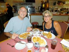 Happy couple enjoying dinner at the Village Inn Restaurant in Huntley