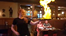 Serving flaming Saganaki at Village Squire Restaurant in South Elgin