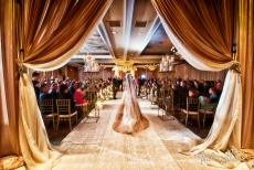 Bride entering ceremony room at Concorde Banquets in Kildeer - photo credit Andre LaCour