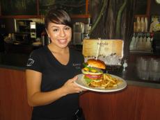 Friendly staff serving the classic burger at Xando Cafe in Hickory Hills